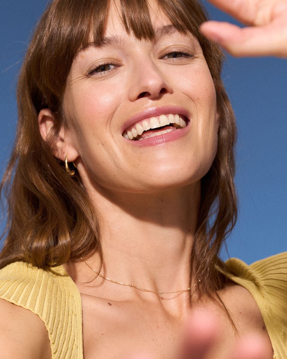woman applying NIVEA Q10 power anti-wrinkle cream